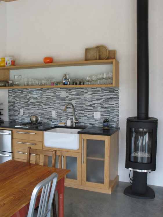 modern studio kitchenette and woodstove